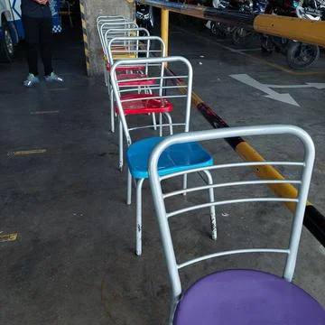 Queue seats to wait their turn Stock Photos