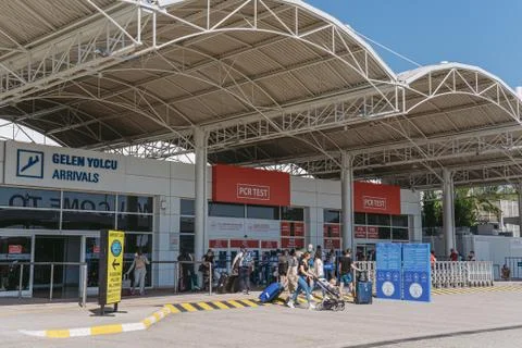 Queue of tourists standing after arrival at PCR test laboratory of airport. Stock Photos