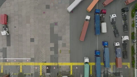 Queue of trucks in logistic site. Birds eye footage of transport terminal with Video stock 203934143