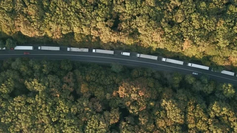 The queue of trucks standing on the road. Top view of the trucks. Stock Footage 141607571