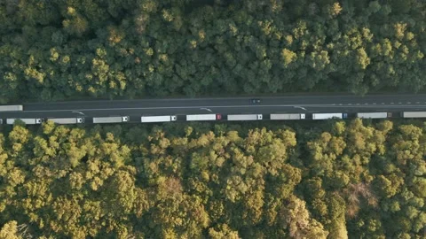 The queue of trucks standing on the road. Top view of the trucks. Stock Footage 141608540
