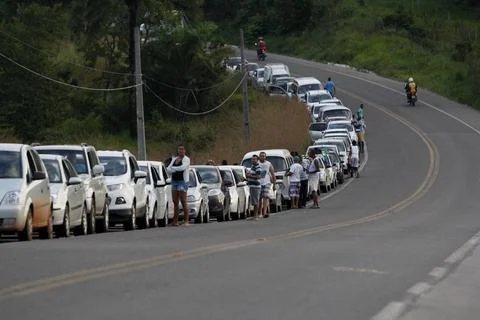  queue of vehicles to access the ferry boat system itaparica, bahia, brazi... Stock Photos