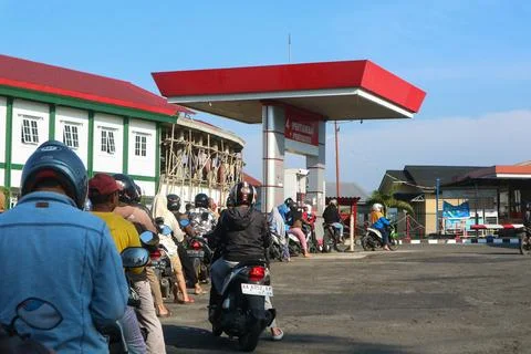 Queue of vehicles refueling at Pertamina Gas Station Stock Photos