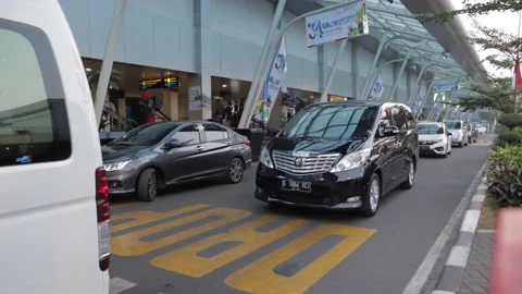 Queueing Cars at Drop Off Zone at Husein Sastranegara Airport Stock Footage 132310637