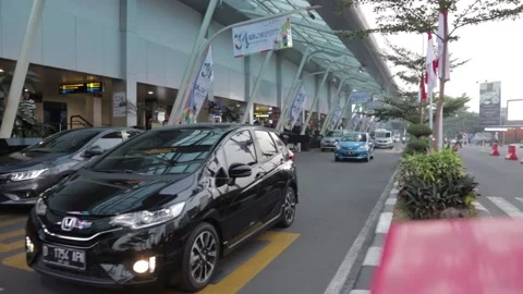 Queueing Cars at Drop Off Zone at Husein Sastranegara Airport Stock Footage 132310937