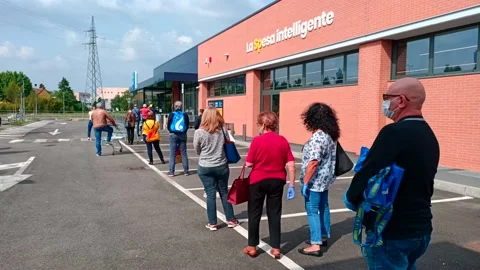 Queuing to enter in the supermarket Stock Footage 130377977