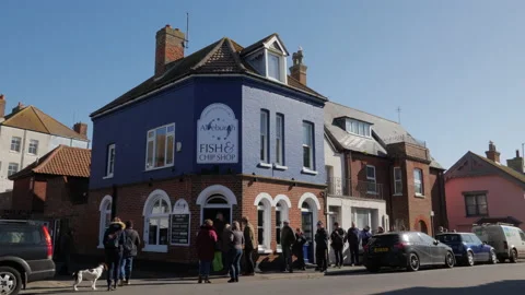 Queuing for fish and chips in Aldeburgh Suffolk Stock Footage 172268833