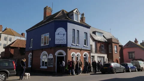 Queuing for fish and chips in Aldeburgh Suffolk Stock Footage 172272278