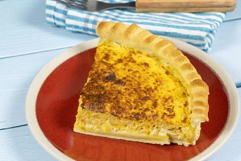 Quiche cut in a dish Stock Photos