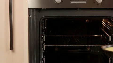 Quiche Lorraine being place in the oven Stock Footage 24670153