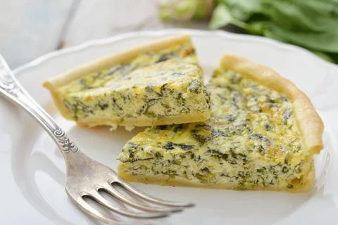 Quiche pie with spinach Stock Photos