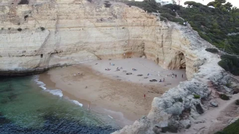 Quick Aerial Landscape Pan of Sandy Beach with People Enjoying Life Stock Footage 249250984