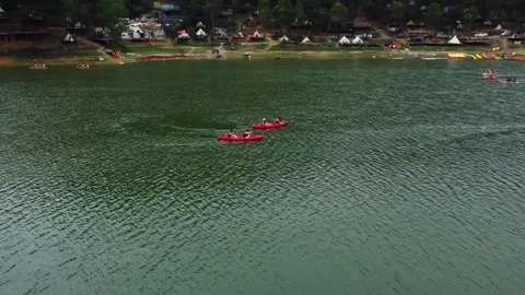 A quick aerial shot, people floating in a boat Video stock 242029441