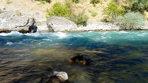 Quick and cool river Ugam in mountain Tashkent Stock Footage 79024698