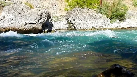 Quick and cool river Ugam in mountain Tashkent Stock Footage 79024746