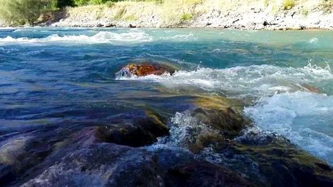 Quick and cool river Ugam in mountain Tashkent Stock Footage 79037371