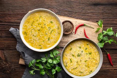 Quick and simple spicy egg drop soup with parsley and chilli Stock Photos