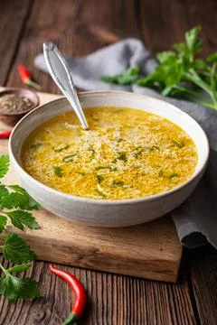 Quick and simple spicy egg drop soup with parsley and chilli Stock Photos