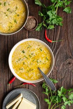Quick and simple spicy egg drop soup with parsley and chilli Stock Photos