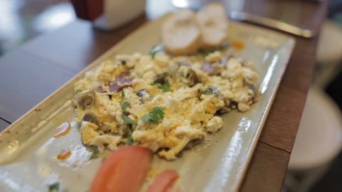 Quick and tasty scrambled eggs, mushrooms and tomatoes lunch. Stock Footage 102519120