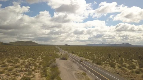 Quick ascent in drone over 2-lane highway Stock Footage 125232149