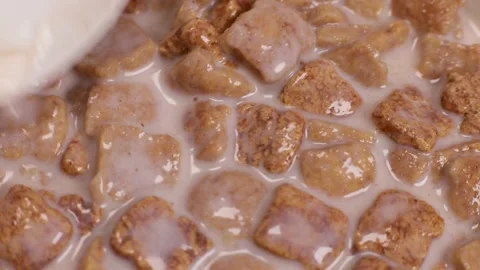 Quick breakfast, corn pads with milk stir spoon Stock Footage 243723105