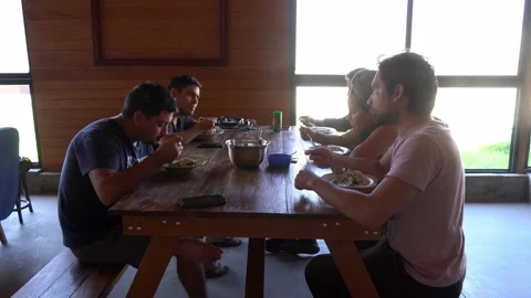 Quick camera of friends having breakfast together at holiday table having soup l Video stock 199577819