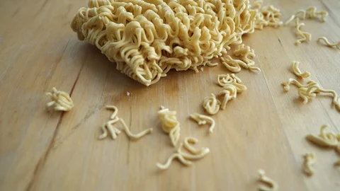 Quick cooking noodle on a wooden background Stock Footage 127581509
