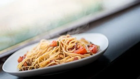 Quick dinner idea - takes 15 minutes - Italian spaghetti pasta with herbs, to Stock Photos