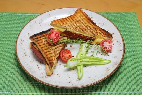 Quick dinner toast with ham and cheese - panini english toast french with b.. Stockfoto's