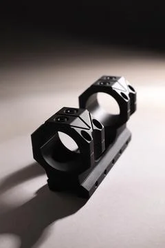 Quick disconnect sniper cantilever scope mount on grey background, closeup Stock Photos