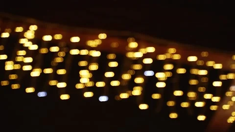 Quick, dizzying swaying view of blurry lights of led garland at night. Stock Footage 237243531