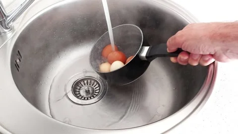 Quick Egg Cooling Hack: Cold Water Trick for Easy Peel Perfect Texture Stock Footage 317435232