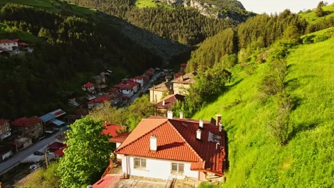 Quick Flight Behind a House Accend to Reveal Massive Hills Hidden Village Sunset Stock Footage 274141239