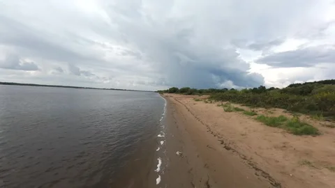 A quick flight over the river bank, it’s summer outside and the deserted beach Stock Footage 280851495