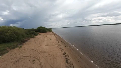 A quick flight over the river bank, it’s summer outside and the deserted beach Stock Footage 280851515