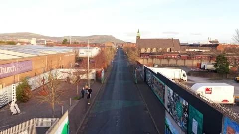 Quick front-on 4K 60FPS aerial video of the Belfast Peace Wall in Belfast Stock Footage 325830916