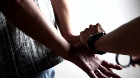 Quick handcuffing of the criminal Stock Footage 136899558