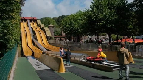 A quick inflatable boat ride down a canal at high speed from a water slide. Stock Footage 240468021