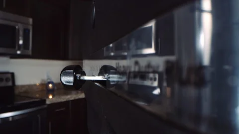 Quick macro dolly in as finger switches on kitchen mixing device for baking Stock-Footage 129293149