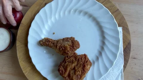 Quick meal of leftover chicken and chips Stock Footage 247663125