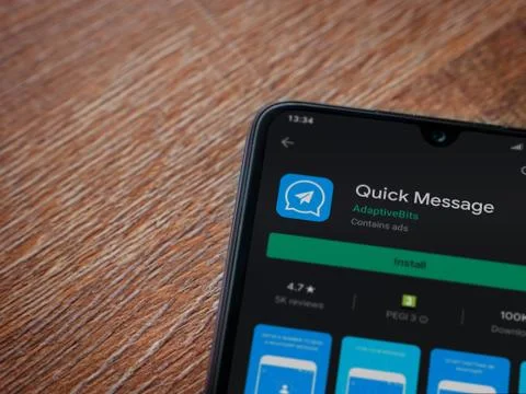 Quick Message app play store page on the display of a black mobile smartphone Stock Photos