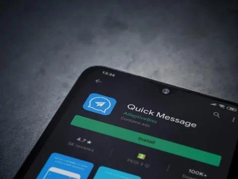 Quick Message app play store page on the display of a black mobile smartphone Stock Photos