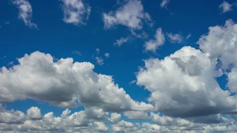 Quick motion of fluffy clouds. 4K Time Lapse Stock Footage 210422099