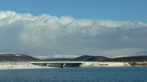Quick move North of autumn low clouds over the lake. Video stock 58362979