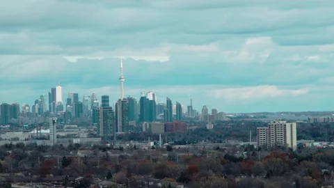 Quick moving clouds over distant City. Stock Footage 82539342