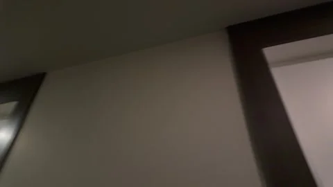 Quick Pan from Apartment Corridor to Emergency Exit Sign Stock Footage 345981267