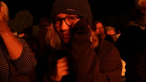 Quick pan around to teen afraid of the huge fire in front of her 스톡 동영상 122306364