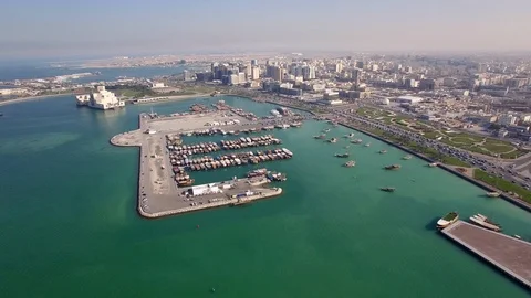 Quick pan of drone over Doha croisette to the museum of islamic art and port Stock Footage 105730500
