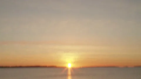 Quick pan or tilt to sunrise on the horizon over water in Helsinki, Finland Stock Footage 146263479